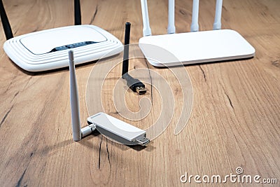Different types of Wi-Fi routers, modern and old technology. Wireless ethernet connection signal. USB Wifi Receiver Wireless Stock Photo