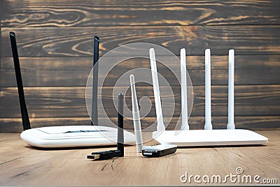 Different types of Wi-Fi routers, modern and old technology. Wireless ethernet connection signal. USB Wifi Receiver Wireless Stock Photo