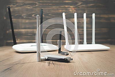 Different types of Wi-Fi routers, modern and old technology. Wireless ethernet connection signal. USB Wifi Receiver Wireless Stock Photo