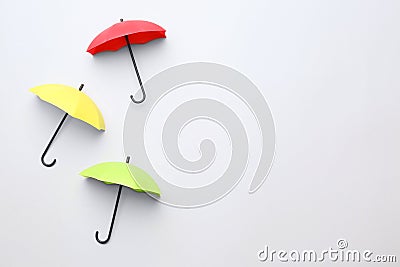 Different umbrellas on white background, top view. Space for text Stock Photo