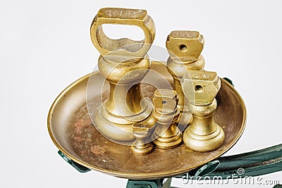 Different vintage brass weights unit standing Stock Photo