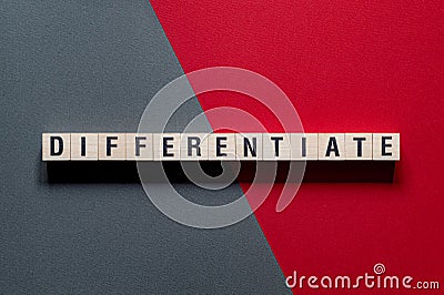 Differentiate - word concept on cubes Stock Photo