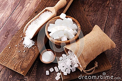 Differnt kind of sugar in wooden bowl and spoon Stock Photo