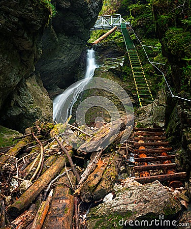 Difficul trail with ladder near the waterfall in canyon of National park Slovak paradise Stock Photo