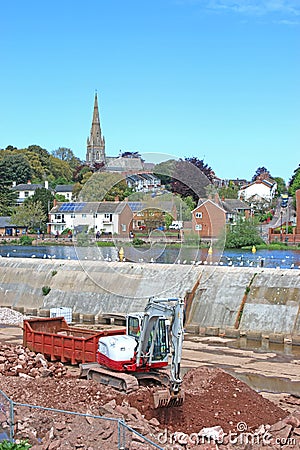 Digger working on Exeter flood defences Stock Photo