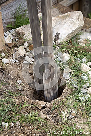 Digging a fence hole Stock Photo