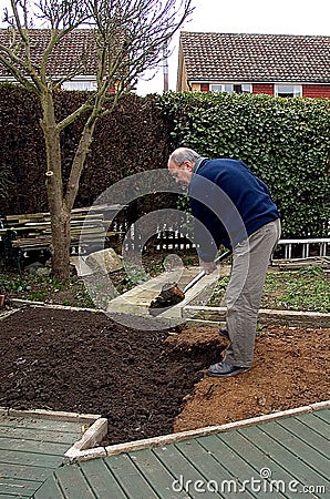 Digging the garden Stock Photo