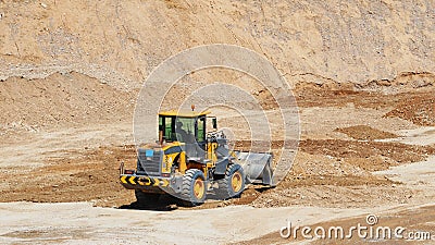 Digging work with front wheel loader Editorial Stock Photo