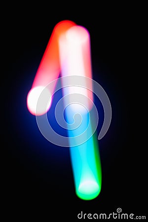 Digit 1. One. Glowing numbers on dark background. Abstract light painting at night. Creative artistic colorful bokeh. New Year. Stock Photo