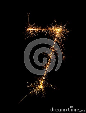 Digit 7 or seven made of bengal fire, sparkler fireworks candle isolated on a black background Stock Photo