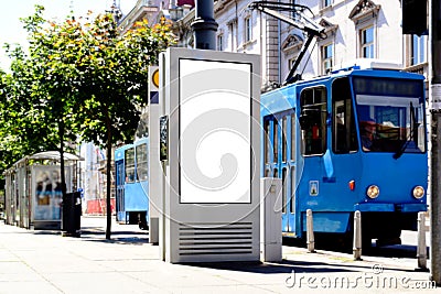 digital ad display at tram stop. blank white lightbox. empty billboard. busstop advertising. Stock Photo