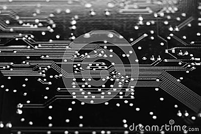 Digital AI, Artificial Intelligence or machine learning background concept, closed up of computer circuit board with solder on bl Stock Photo