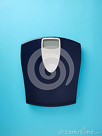 Digital bathroom scale on blue background Stock Photo