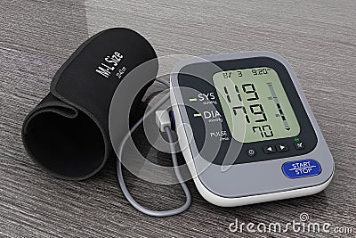 Digital Blood Pressure Monitor with Cuff. 3d Rendering Stock Photo