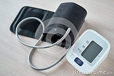 Digital blood pressure monitor on the table, closeup. Helathcare and medical concept Stock Photo