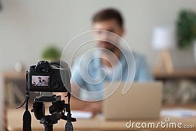 Digital camera filming commercial vlog of man teacher vlogger coach Stock Photo