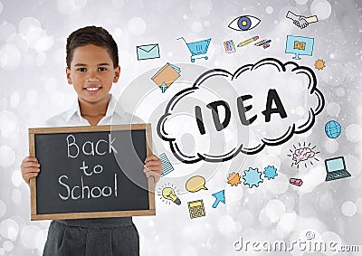 Boy holding back to school blackboard with idea graphics Stock Photo