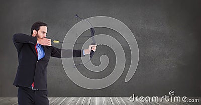 Businessman shooting arrow Stock Photo