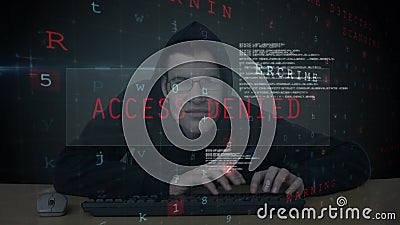 Hacker trying to log in. Digital composite of Caucasian Hacker with black hood trying to log in to the computer while binary codes moves on the foreground in Hacker trying to log in. Digital composite of Caucasian Hacker with black hood trying to log in to the computer while binary codes moves on the foreground in