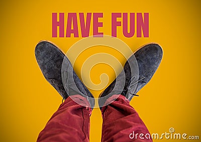 Have fun text and Grey shoes on feet with yellow background Stock Photo