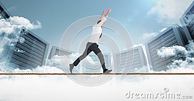 Digital composite image of businessman running on rope against servers Stock Photo