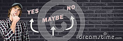 Man thinking with Yes No Maybe with arrows graphic on wall Stock Photo