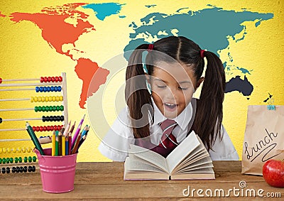 Schoolgirl at desk in front of colorful world map Stock Photo