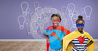 Superhero kids with purple wall with light bulb graphics Stock Photo