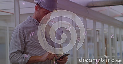 Digital composition of multiple alphabets floating against male architect using smartphone Stock Photo