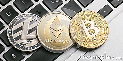 Digital cryptocurrencys Bitcoin, Ethereum, Litecoin on a notebook Editorial Stock Photo