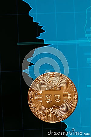 Digital Currency Bitcoin Closeup With Financial Graphics Stock Photo