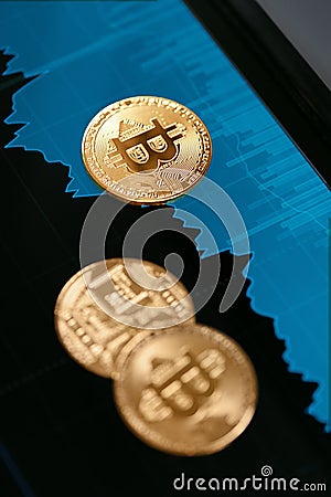 Digital Currency Bitcoin Closeup With Financial Graphics Stock Photo