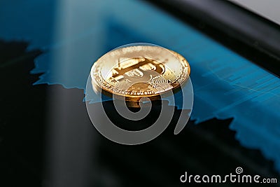 Digital Currency Bitcoin Closeup With Financial Graphics Stock Photo