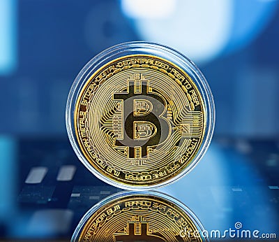 Digital currency concept - bitcoin on reflective, technology style background Editorial Stock Photo