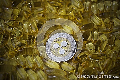 Ripple coin in yellow drugs Editorial Stock Photo