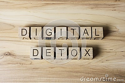 DIGITAL DETOX text on wooden cubes on wooden background Stock Photo