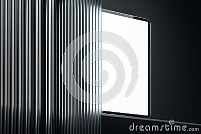 Digital device with a blank screen partially hidden behind a ribbed surface on dark background. 3D Rendering Stock Photo
