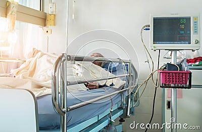 Digital device for measuring blood pressure monitor with elderly patient sleep on the bed in hospital Stock Photo