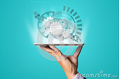 Digital Device Tablet display Virtual Cogwheel or Gear Stock Photo