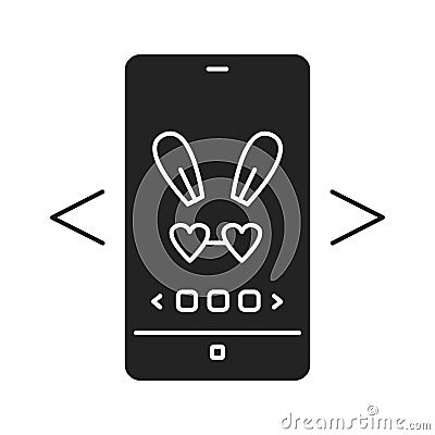 Digital face application black glyph icon. Photo filter bunny ears in smartphone. Pictogram for web page, mobile app, promo. UI UX Stock Photo