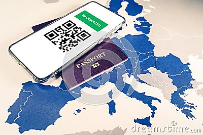 Digital green passport with QR code on a smartphone over an EU map Stock Photo