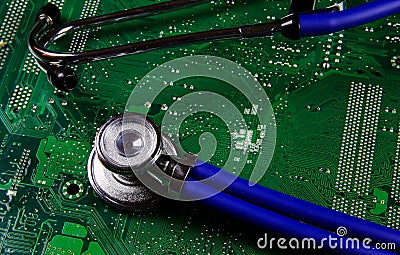 Digital health patient data storage concept - Isolated blue stethoscope on green computer circuit board Stock Photo