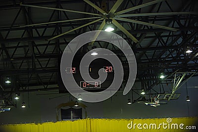 Digital indoor main scoreboard score. Volleyball players are on a field. Stock Photo