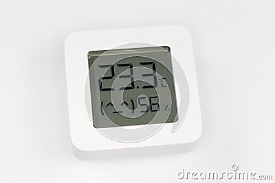 Digital indoor mini thermometer with hygrometer on a white surface Stock Photo