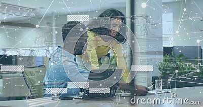 Digital interface and data analysis image over colleagues collaborating in office Stock Photo