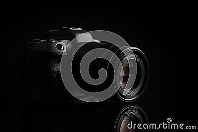 Digital mirrorless camera on black background Stock Photo