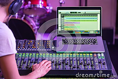 Digital mixer in a recording Studio , with a computer for recording music. On the background of the sound engineer at work Stock Photo