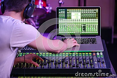 Digital mixer in a recording Studio , with a computer for recording music. On the background of the sound engineer at work Stock Photo
