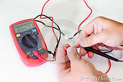 Digital multimeter or multitester or Volt-Ohm meter, an electronic measuring instrument that combines several measurement function Stock Photo