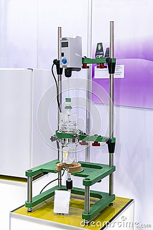 Digital overhead stirrer with impeller & glassware on stand device of lab application to chemical reaction processes in the Stock Photo